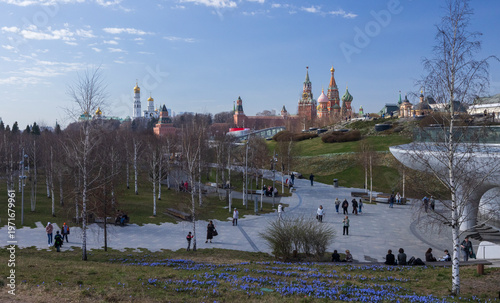 A picturesque view of the Kremlin featuring its iconic golden domes and towers against a vibrant sky, epitomizing the historical and architectural grandeur of Russia.