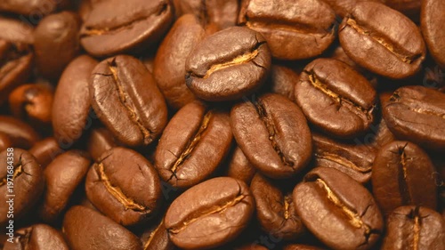 Close-up of roasted coffee beans. Beautiful brown coffee beans rotating in a circle..