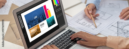 Graphic designer software for modern design of web page and commercial brisk ads showing on the computer screen