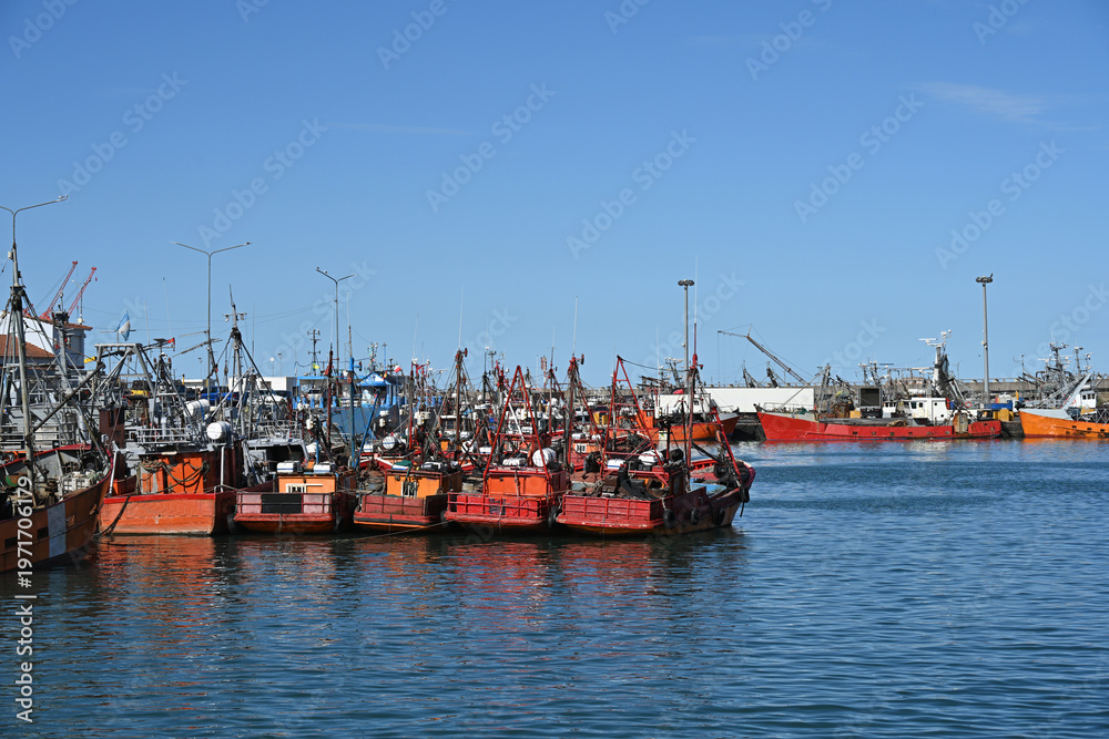 Fototapeta premium fishing boats in port, construction site with crane