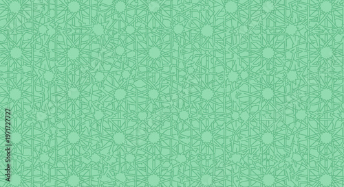 A detailed intricate geometric pattern featuring repeating star shapes and intersecting lines in a beautiful soft mint green color palette