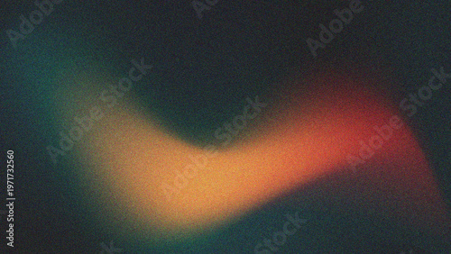 Fotografie A striking reddish-orange color in the center, surrounded by dark green and muted blue at the edges