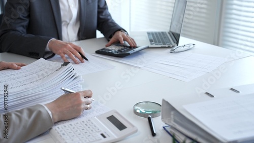 Fotografía Accountants processing financial documents and taxes, managing corporate finance in a modern office