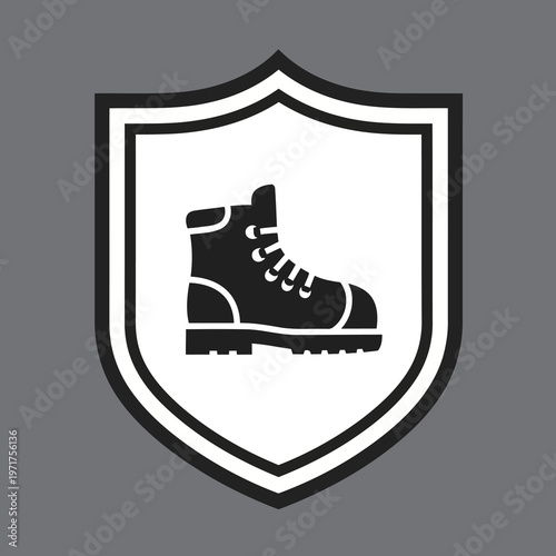 Work boot icon in protective shield. Symbolizes safety, durability, secure foot protection for demanding tasks, challenging environments, reliable gear