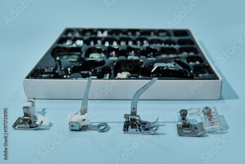 Collection of sewing machine presser feet and tailoring tools