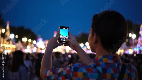 Man taking photo with smartphone.