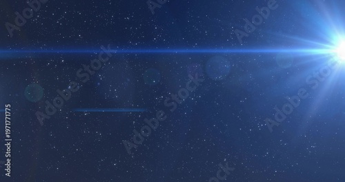 Emitting bright blue star sending radial beams across outer space, lens artifacts, copy space