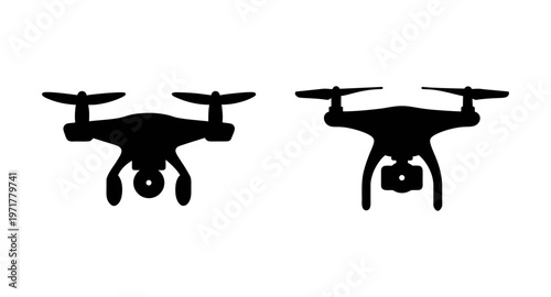 Two black drone silhouettes flying side by side on a pure