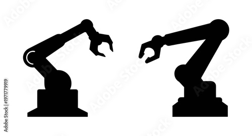 Two robotic arms reaching for each other in a factory setting with industrial automation and technology