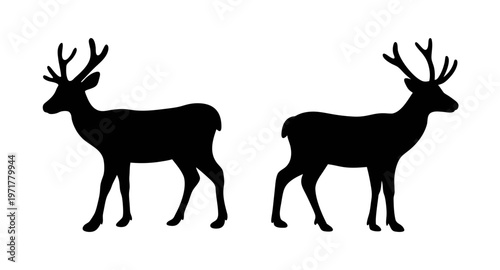 Two black deer silhouettes standing side by side