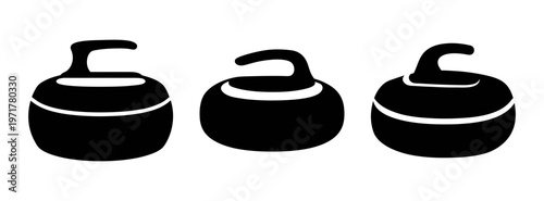Three black curling stones with handles on top