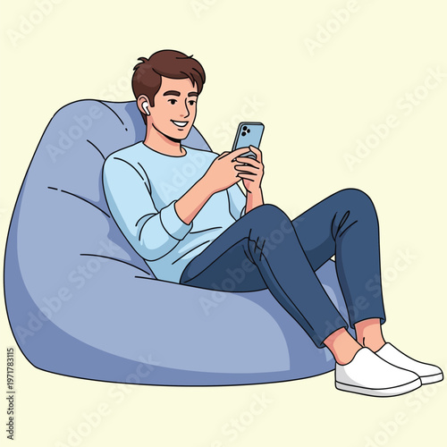 Young man relaxing on bean bag using smartphone with earphones, casual leisure activity.
