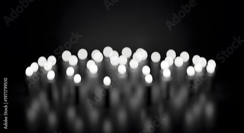 Abstract image of multiple glowing white orbs on a dark reflective surface