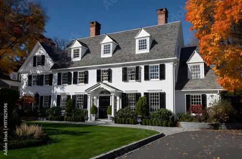 Large white two-story american style house with gray roof and green lawn