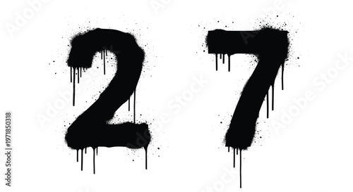 Black graffiti spray paint numbers 27 with heavy drips and urban splatter isolated on white background