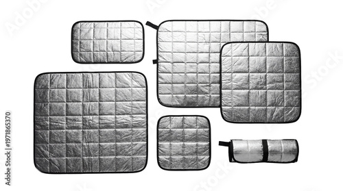 Set of silver car window sunshades with thermal insulation foil isolated on white background, collection of foldable sun reflectors for vehicle interior protection