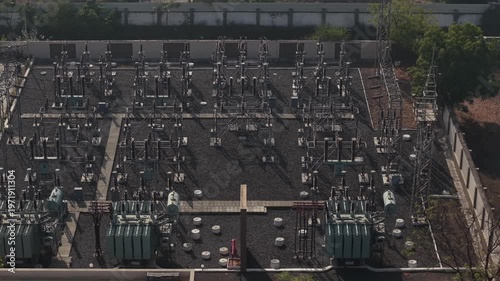 Close Detail of Three Phase Power Transformers in an Industrial Electrical Grid Station.
