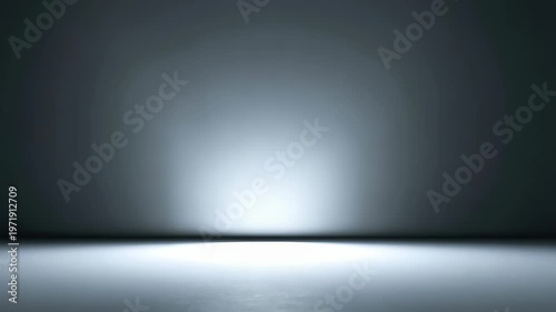 Minimalist empty room with smooth concrete floor and illuminated wall, creating a modern futuristic atmosphere. Soft spotlight casts gentle gradient shadows across the seamless background