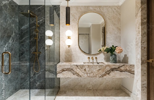 The bathroom is beautifully designed, decorated with white marble tiles and modern accessories.