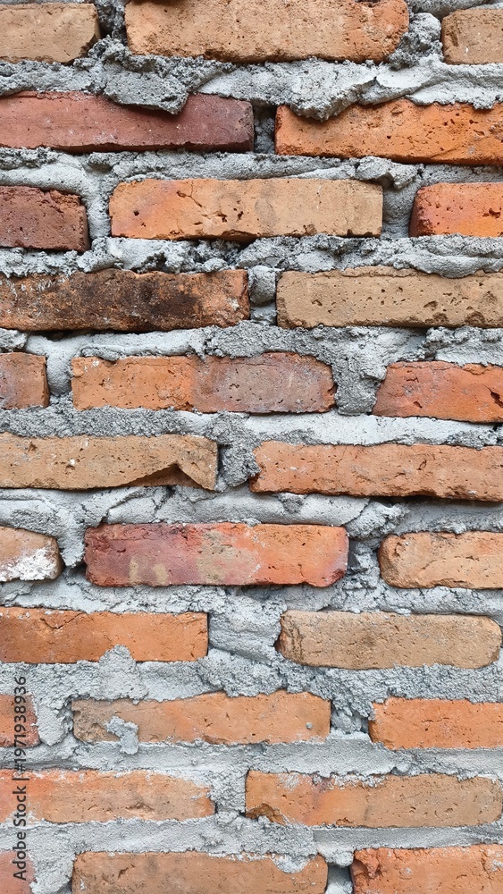 Obraz premium Close-Up Brick Wall Texture with Rough Cement Mortar Background