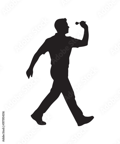 Silhouette of a man throwing a dart, captured mid-stride, ready to aim for the bullseye in a game of darts.
