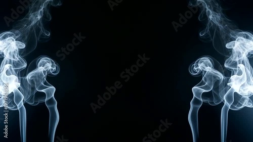 Symmetrical Wisps of White Smoke Against a Black Background.