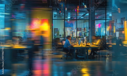 Blurred figures work in a modern, colorful, and busy office environment