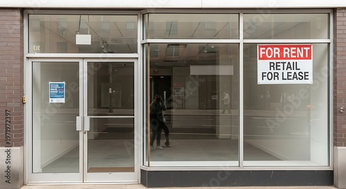 Empty retail space with for rent signage on glass windows