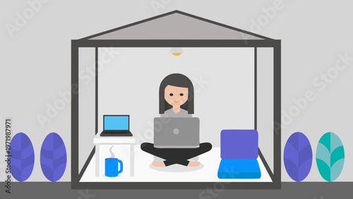 A woman works on her laptop from a cozy outdoor tent office