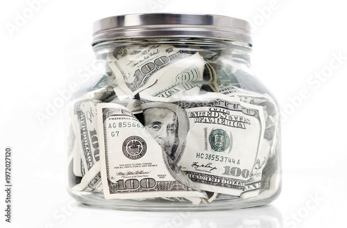dollars in glass jar