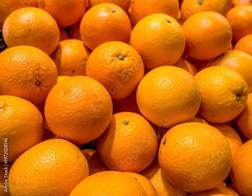 Fresh Oranges - A Vibrant Pile of Citrus Fruits.