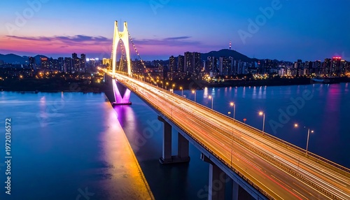 Evening Bridge Lights Over Water Reflecting City Skyline.