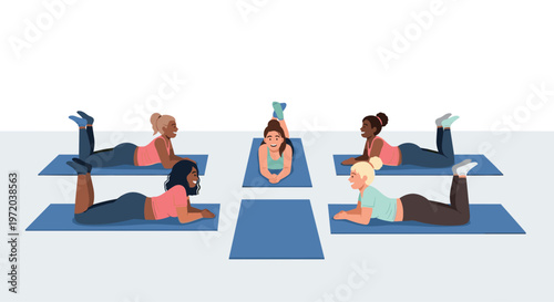 A diverse group of active women in colorful sportswear lie comfortably on blue exercise mats while engaging in a friendly social conversation during a class.