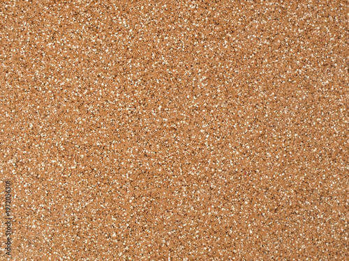 Natural corkboard textured surface with speckled brown granules porous artistic design