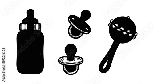 Baby items isolated against a black background feeding accessories
