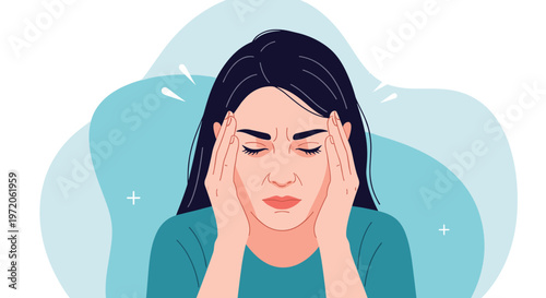 Young woman suffering from a severe headache or migraine holds her temples with a painful and stressed facial expression.