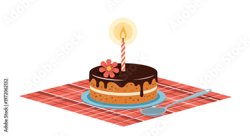 Delicious chocolate birthday cake with a single lit candle and a decorative flower rests on a red plaid tablecloth for a warm celebration.