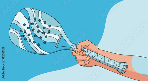 Close up of a hand firmly gripping the handle of a blue padel racket with a wave pattern on the face against a two tone blue background.