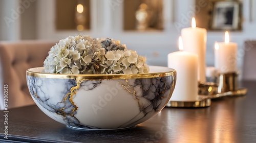 Marble bowl filled with hydrangeas and candles, golden rim detail