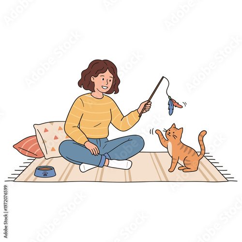 Woman playing with cat using toy on floor indoors with pillows
