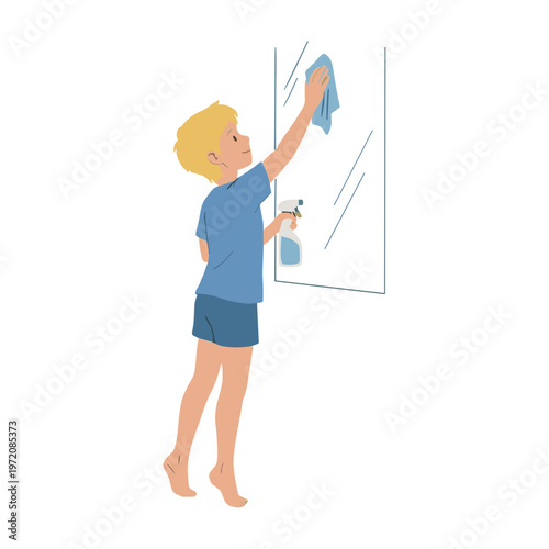 A young boy thoroughly cleaning a large window with a cloth and spray.