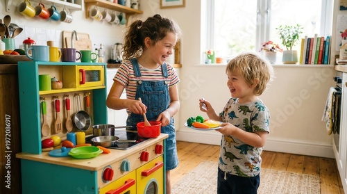 Children playing with toy kitchen indoors.