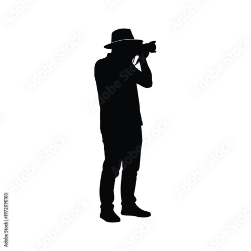 Black Silhouette of Photographer with Wide-Brim Hat Holding Camera Symbolizing Creativity and Observation