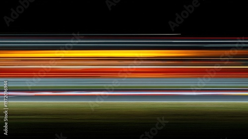 longexposure. Long exposure of race track lights creating smooth, flowing color bands on dark background. mobility guides, transit brochures, designed for mobility and urban transit guides.