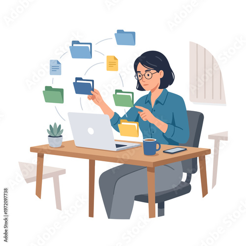 Woman organizing digital files and documents on laptop at desk.