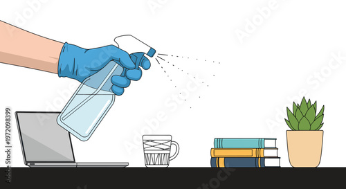 A hand wearing a blue protective glove sprays a clear disinfectant bottle over a workspace containing a laptop, three books, and a small potted plant.