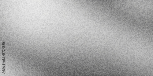 A dark brushed aluminum steel surface with a gray textured metal pattern and a grunge vintage backdrop creates a blank rough material design for a modern wallpaper