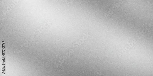 A sleek brushed metal texture features a silver stainless steel surface with a dark metallic pattern, creating a gray aluminum backdrop for a modern material design