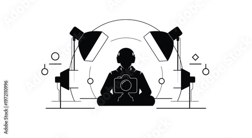 Photographer sitting in a meditative pose with a camera and studio lights around