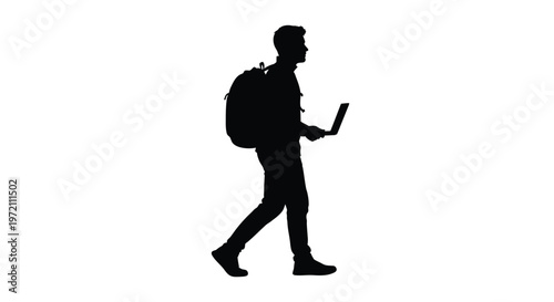 Silhouette of a man walking while using a laptop computer with a backpack on his back